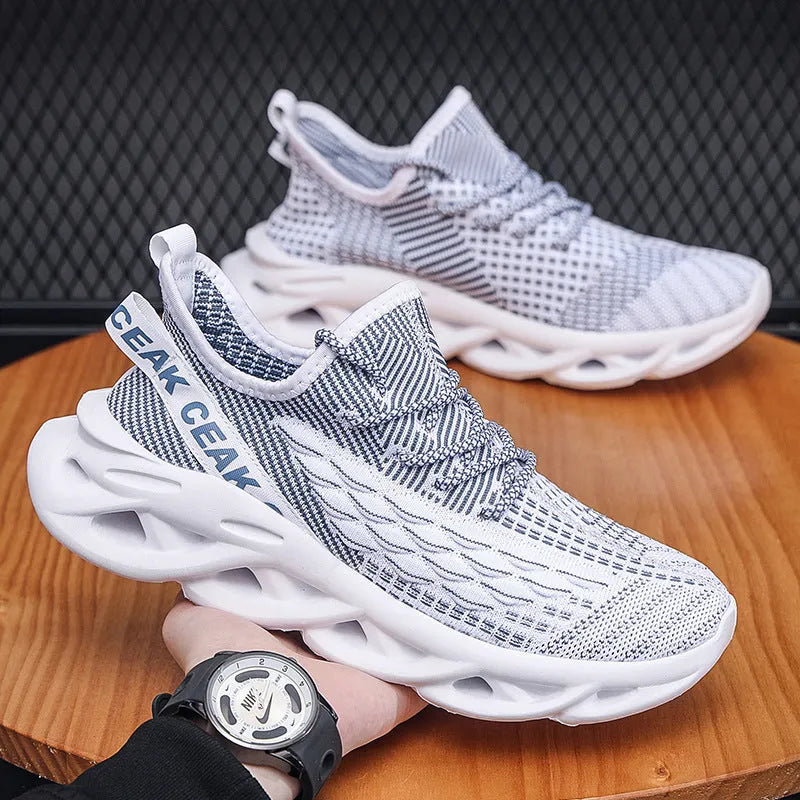 Blade mesh sports shoes in black with low-top design, lace-up closure, and breathable upper