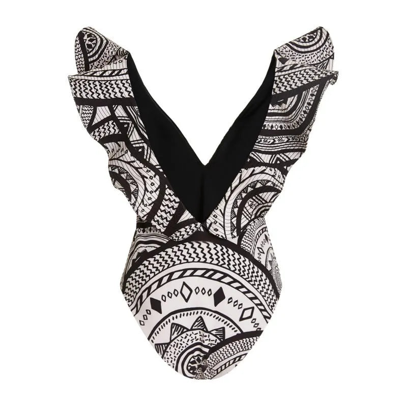 Vintage print deep V-neck one-piece swimsuit for women with matching wrap skirt.