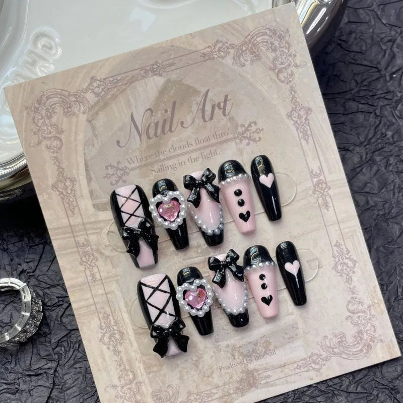 Black and pink hand-painted heart design detachable manicure showing bow pattern and size options