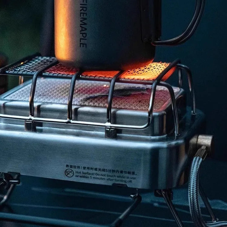 Compact metal outdoor electric heating stove with voltage regulator, shown in a silver finish.