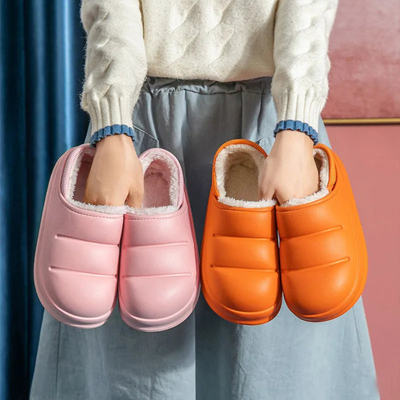 Green EVA waterproof garden slippers with non-slip sole and plush lining shown on wooden decking